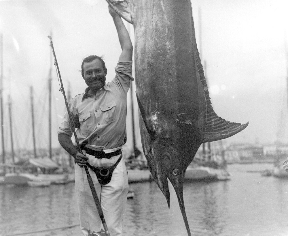 Ernest Hemingway posing with a marlin, Havana Harbor, Cuba i