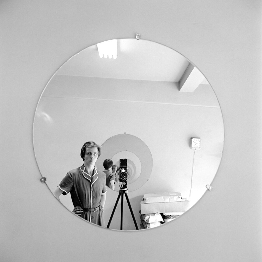 Self Portrait in a Round Mirror