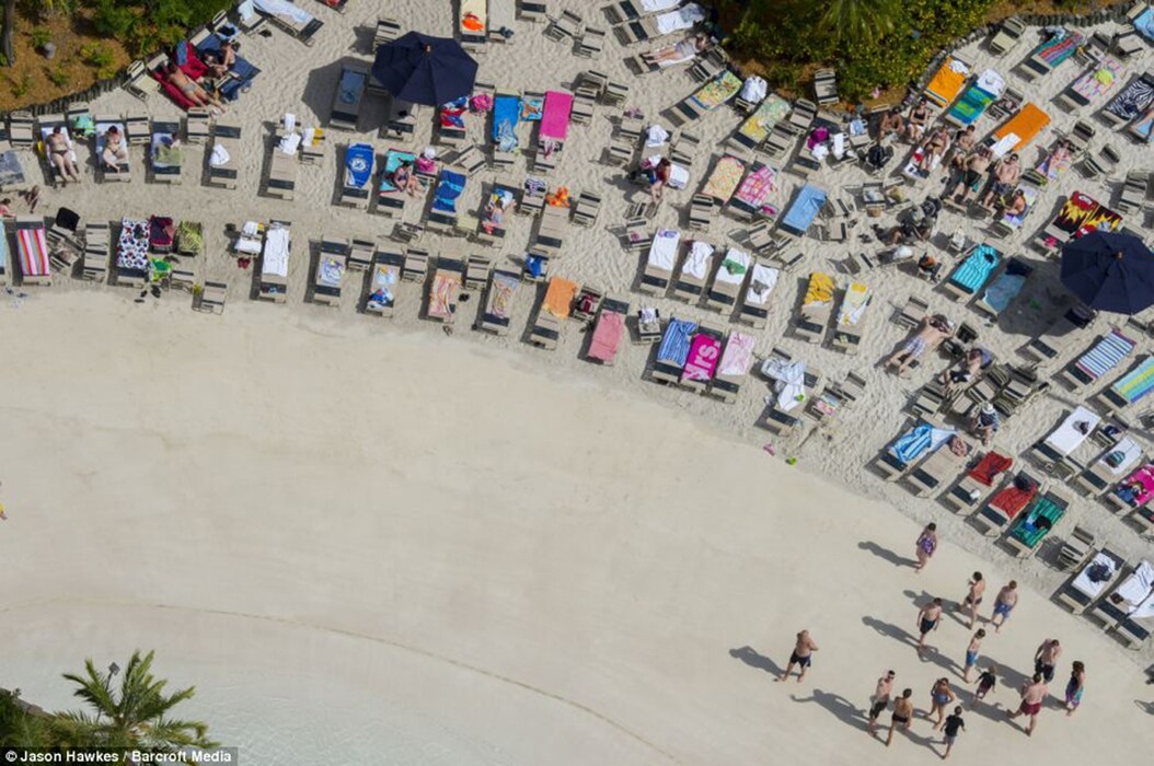Sunloungers on Sandy White Beach at Typhoon Lagoon water par
