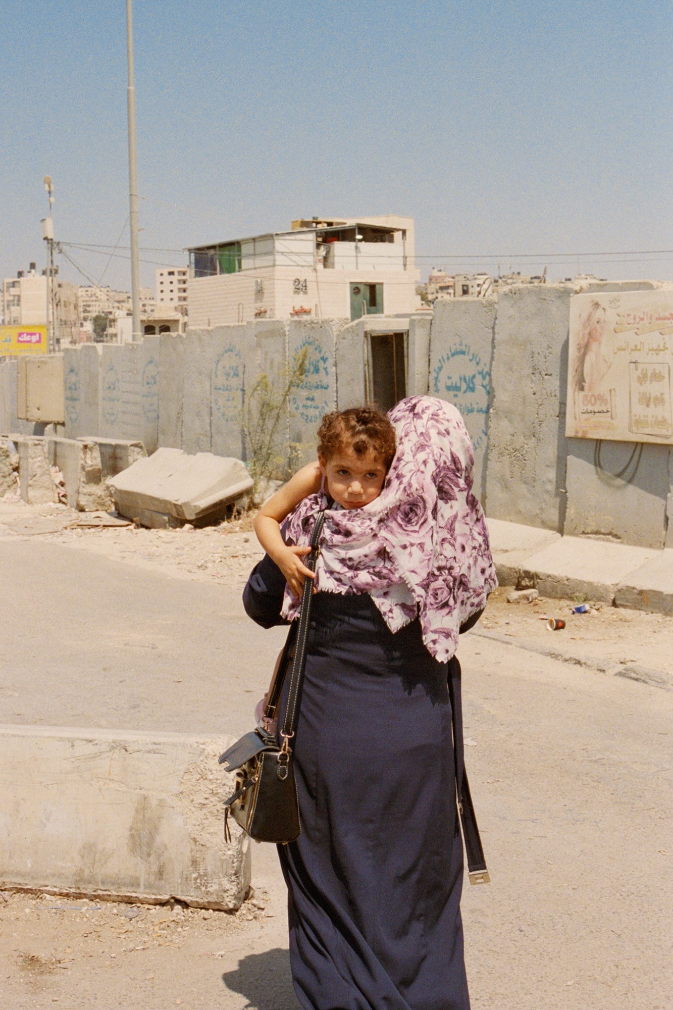 8 - Woman with Daughter at Qalandiya Checkpoint, W