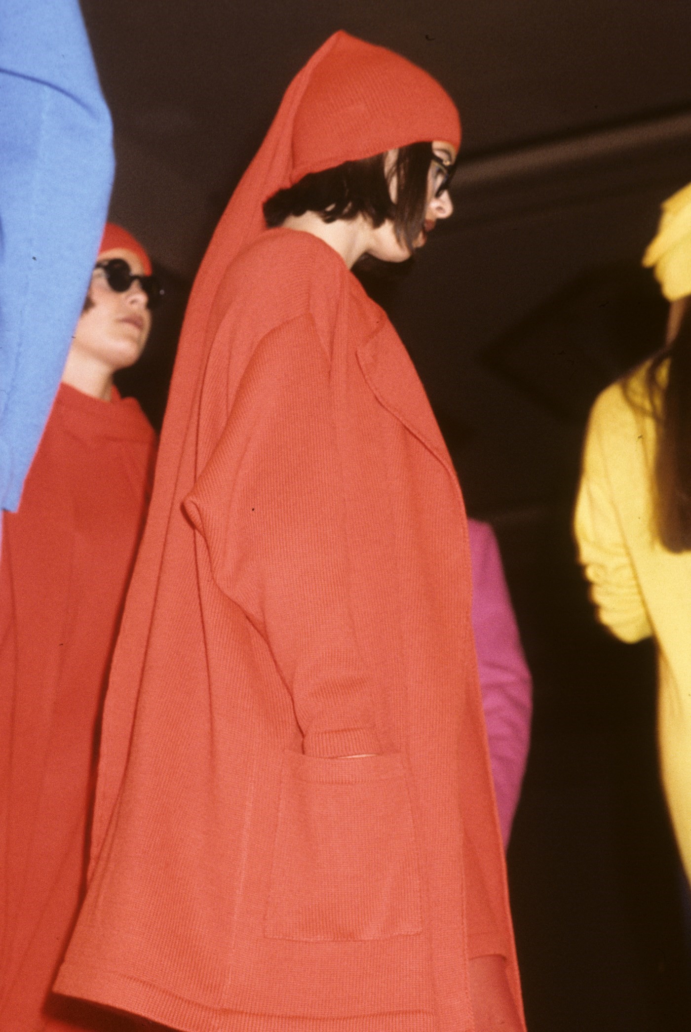 1984. Stephen Sprouse. Model wearing a red coat an