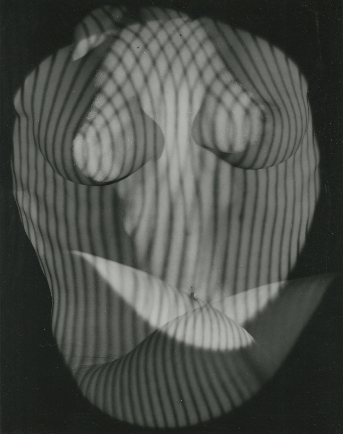 Erwin Blumenfeld_ Surrealist Nude in Shadow, NY, 1