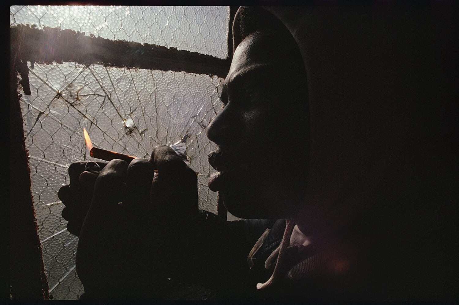 Joseph Rodriguez, Smoking Crack on rooftop, Spanish Harlem, 