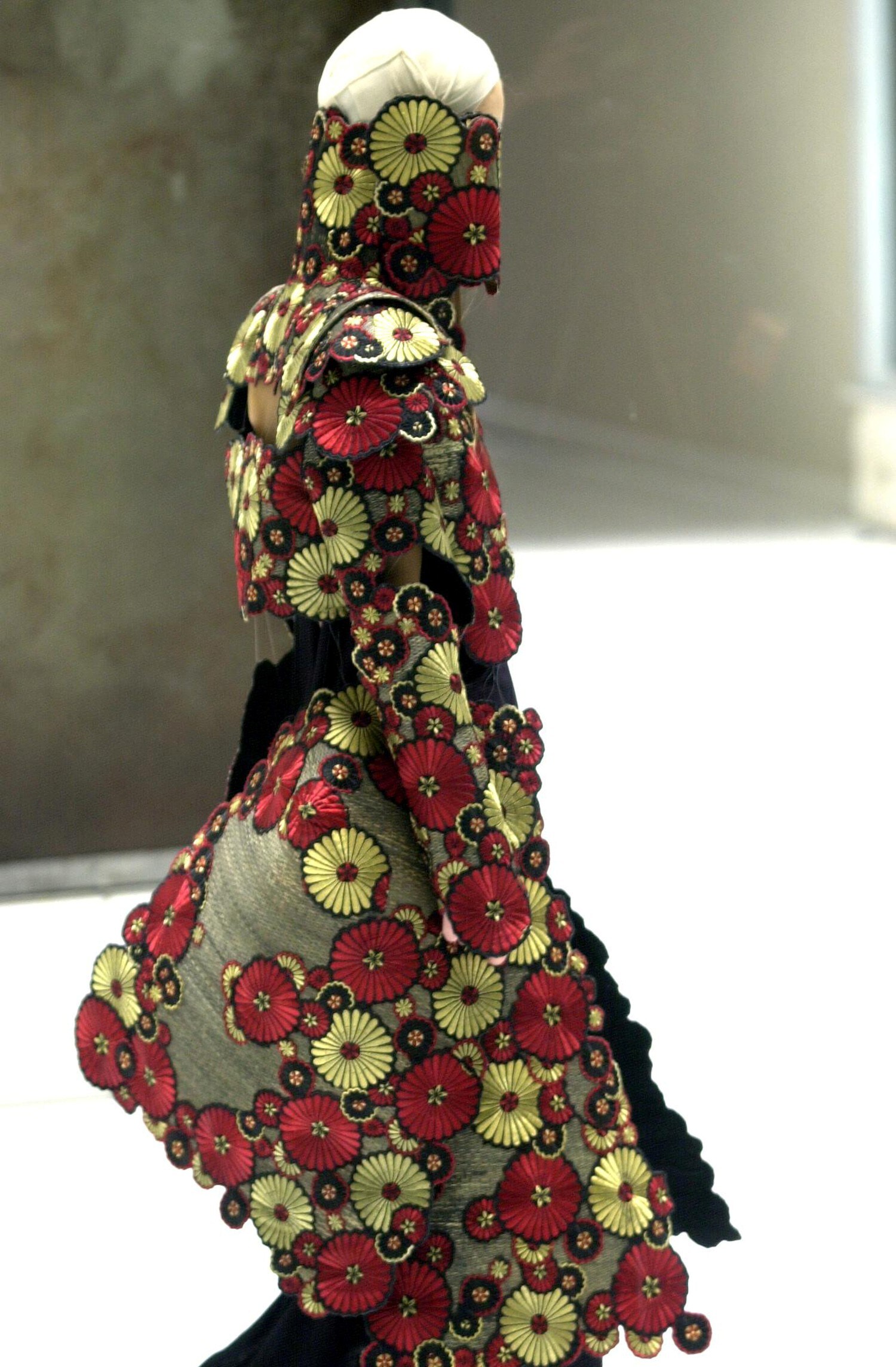 Raffia coat with roundels and Chrysanthemums