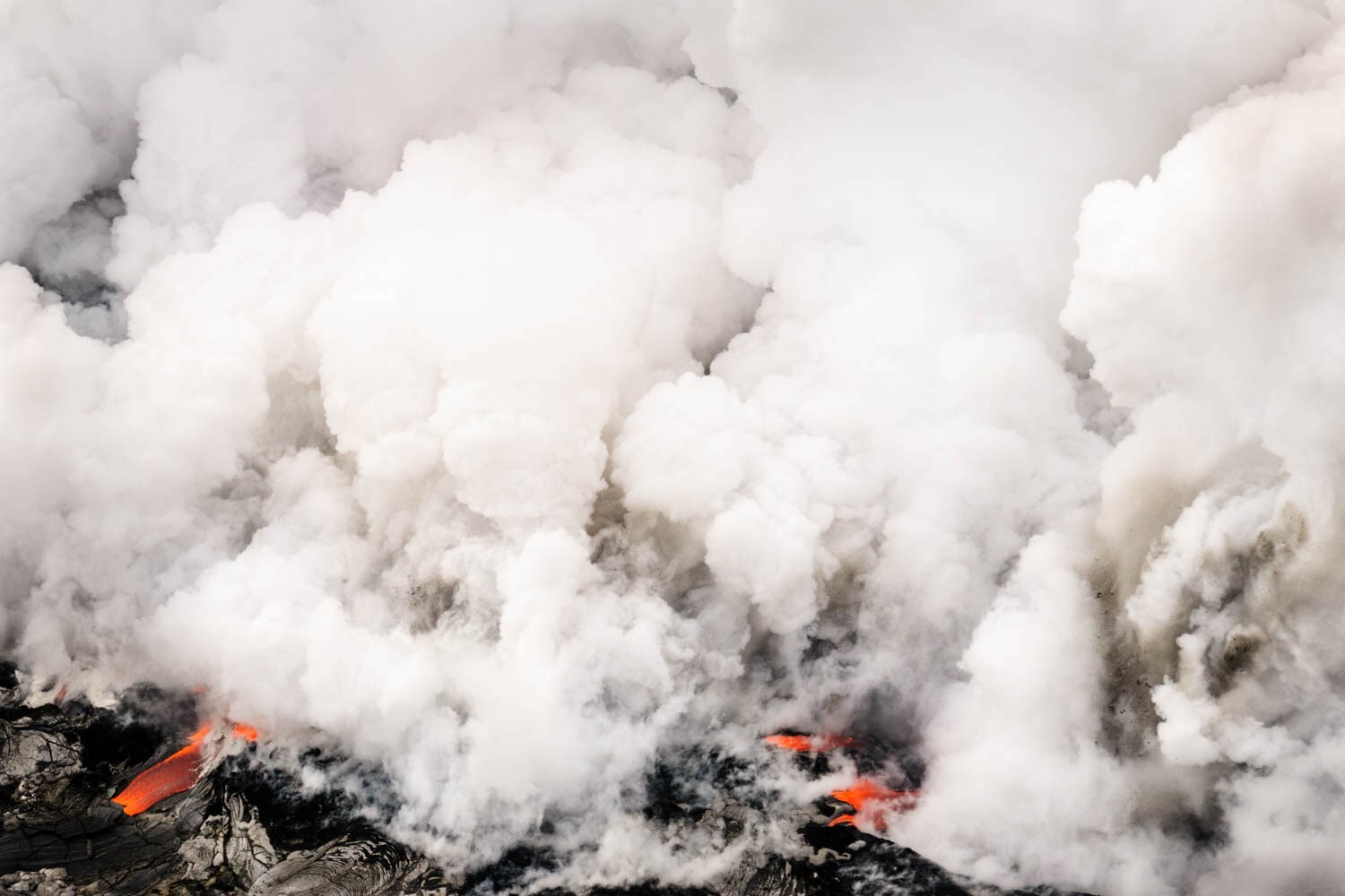 Lava flowing into the ocean from Kilauea Volcano in Hawai’i