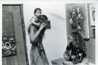 Untitled (woman with baby on shoulders)