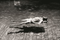 Robert Rauschenberg in Hamadabad, India, in a swim