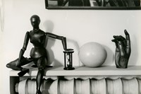 Andre Kertesz, Mantlepiece with wooden figure, woo