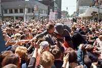&#169; Bill Eppridge. Bobby Kennedy with a crowd in a Midwest cit