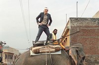 Owen Wilson surfs an elephant, on set of The Darjeeling Limi