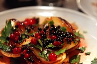 Grilled onions with pickled elderberries and redcurrants