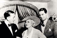 Noel Coward in a signed photograph with Mae West and Cary Gr