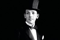 A young Noel Coward in top hat and tails