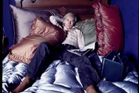 Andy Warhol on the bed of his home in New York