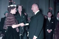 Princess Margaret presents Christian Dior with a s