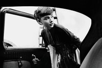 Audrey climbs into the Paramount Studios car waiting to retu