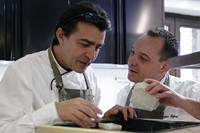 Yannick All&#233;no and a member of his team examine chalk from t