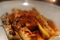 Grilled leeks with dried scallops and bacon in XO sauce