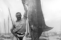 Ernest Hemingway posing with a marlin, Havana Harbor, Cuba i