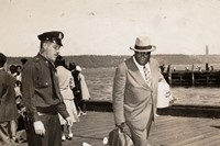 Weegee, [Police officer and lodge member looking at blanket-