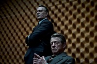 Gary Oldman as George Smiley and John Hurt as Control in Tin