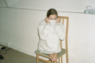 Kate in jumper on chair, 1991