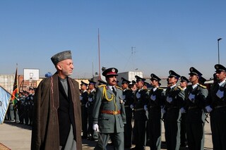 President Hamid Karzai walks down the carpet as he is welcom
