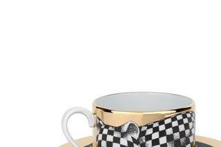 Hand-painted teacup by Fornasetti