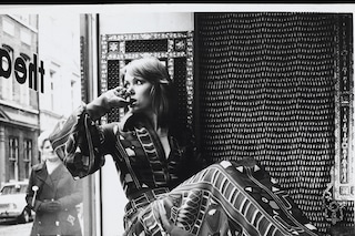 A model in thewindow of the shop. Shewears a silk chiffon dr