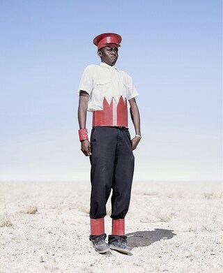 Herero cadet in cardboard hat