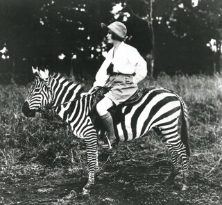 Osa Johnson riding a zebra
