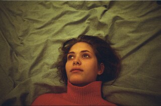 Emma in red polo neck