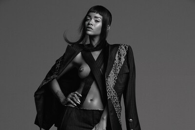 Rihanna wears pinstripe and animal print shorts suit by Comm