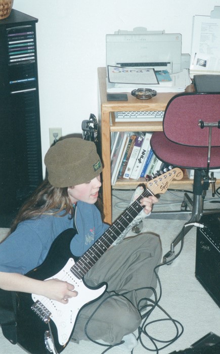 Sara w electric guitar and cast Gr 11