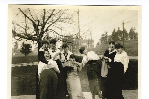 Photograph of women, most likely in a knitting circle, ca. 1