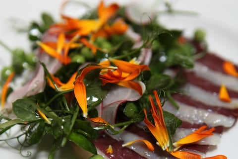 Duck ham, radishes and peas