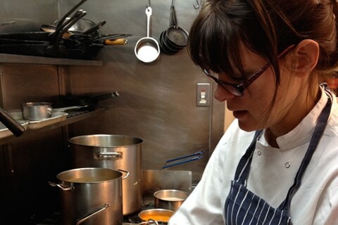 Anna pouring the omelette mix into the pan