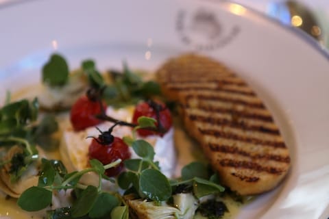 Buratta with artichokes, asparagus and roast cherry tomatoes