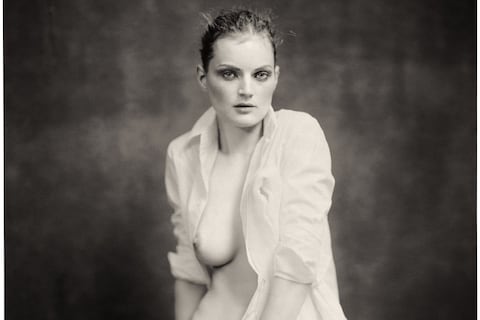 Paolo Roversi, Guinevere sitting on table, Paris, 2004