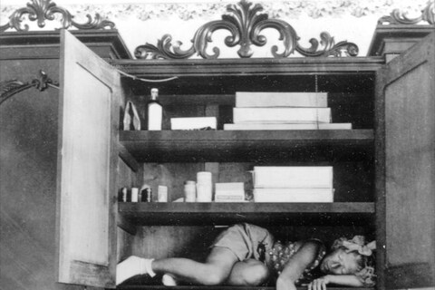 Claude Cahun, Self portrait (in cupboard), c. 1932