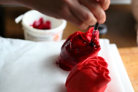 Lily paints the hearts