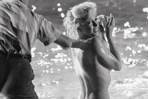 Monroe by the pool&#39;s edge, Whitey Snyder adjusting her makeu