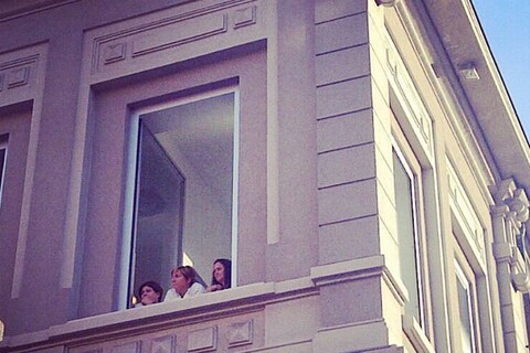 The Prada seamstresses watching guests arrive at the show, M