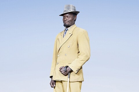 Herero man in yellow suit