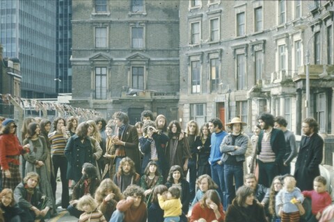 Group photo of squatters in Tolmers Square, organized as par