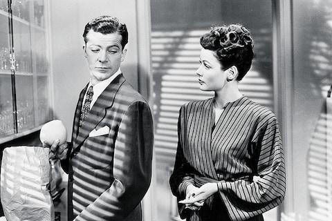 Laura (Gene Tierney), returned from the dead, is given the t