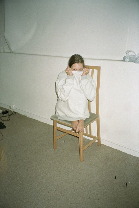 Kate in jumper on chair, 1991