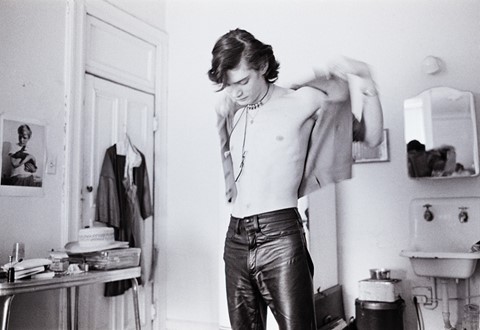 Robert Mapplethorpe gets dressed at the Chelsea Hotel