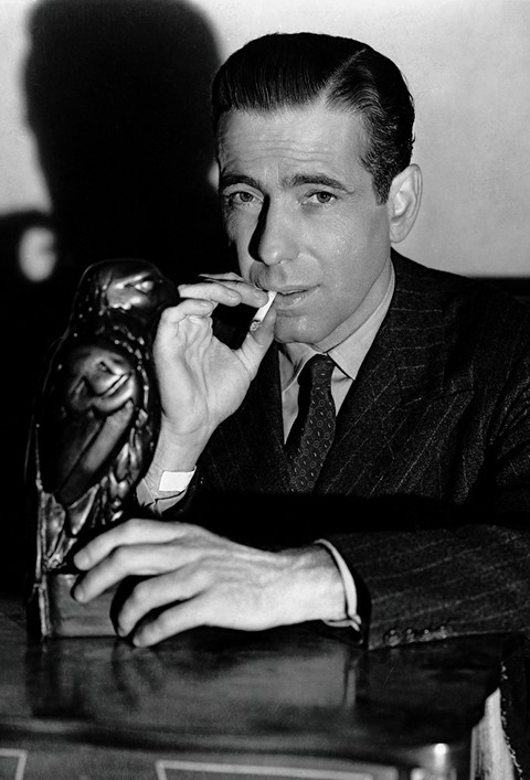 Sam Spade (Humphrey Bogart) is embroiled in the hunt for a m