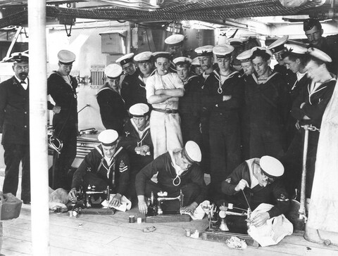 Sailors with sewing machines - archive photo